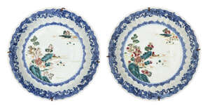 A pair of Chinese enamelled blue and white dishes, 18th century, each raised on a short foot,...