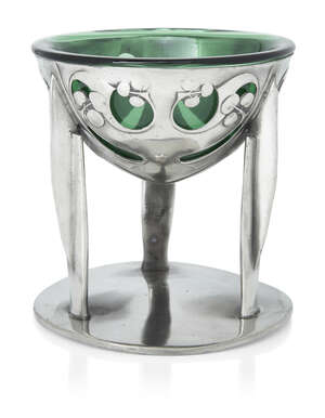 
	
		Archibald Knox (1864-1933) for Liberty & Co, 
		 
		Tudric comport with green glass...