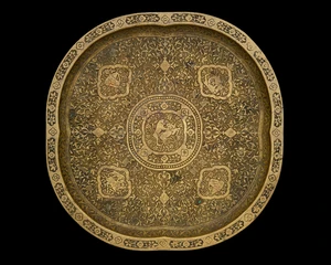 An engraved copper alloy lobed tray,&nbsp;Iran, 19th century or later,&nbsp;
the central lobed medallion...