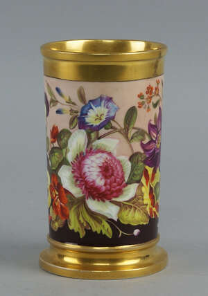 A Rockingham cylindrical spill vase, 19th century, decorated with a band of flowers and foliage including pansies and chrysanthemums between gilt decoration to