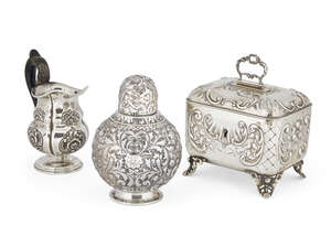 
	
		An Austrian silver sugar box, Vienna, c.1870 designed as a chest raised on four feet, the...
