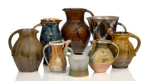 
	
		Clive Bowen (1943-), an earthenware jug 
		c.1980, unsigned 
		A large honey glazed...