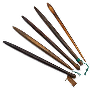 
	
		Five African hardwood throwing clubs, early 20th century, each with tapered ends, 65-72cm...