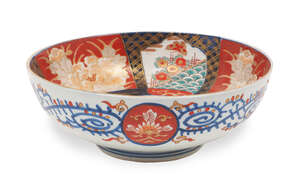 
	
		A Japanese Imari bowl, 19th century, decorated with motifs of chrysanthemums and gardens...