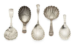 Four Georgian silver shell form caddy spoons, together with an Edwardian example (5)