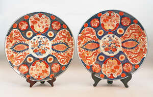 A pair of Japanese Imari porcelain chargers, 19th century, decorated with central roundels of...