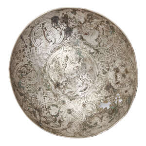 
	
		A Seljuq engraved silver bowl, Iran or Syria, 12th century, of deep form with raised...
