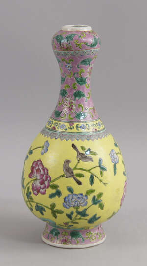 
	
		A Chinese porcelain garlic-head famille rose and yellow bottle vase, late 19th/early 20th...
