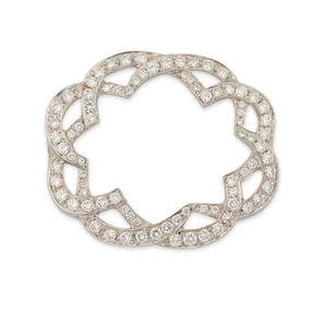 A diamond set component, composed of two interlocking sinuous lines, set with brilliant-cut...