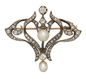 
	
		An Art Nouveau diamond and pearl brooch, of triangular openwork foliate design, set in...
