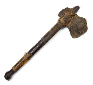 
	
		A Chaco stone and wood war club, the wood shaft bound with hide, possibly snake skin,...