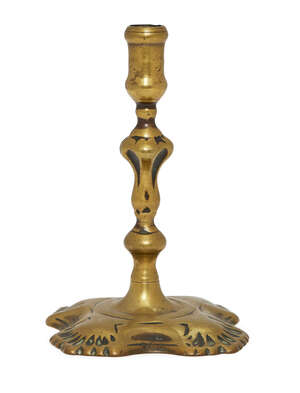 
	
		An English brass miniature candlestick, early 18th century, with knopped stem and foliate...