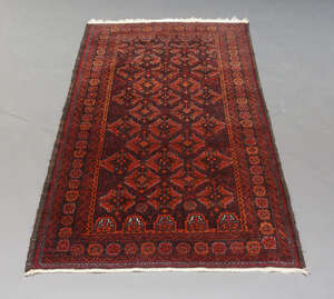 
	
		An Afghan rug with step edge panels enclosed by multiple border, 184cm x 106cm, together...