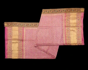 A fuchsia silk and gold thread sari, early 20th century,&nbsp;
The central field with an elegant...