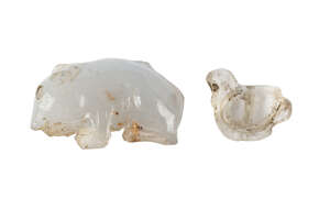 A Western Asiatic rock crystal amulet of a bird, Western Asiatic, 2nd century BC-2nd century AD, 1.9 cm long; and a blue chalcedony mouse, Sumerian, Jemdet Nas