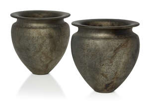 
	
		Keith Munro (British 1958-), a pair of silvered vases 
		1988, impressed date and marks...