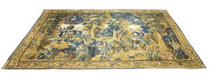 
	
		A Brussels verdure game park tapestry, late 17th century, the main panel depicting a dog...
