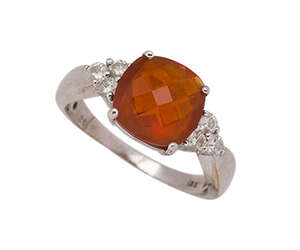 
	
		A fire opal and diamond ring, the cushion-shaped rose-cut fire opal in four claw mount to...
