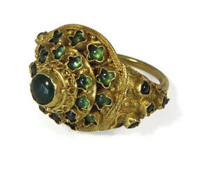 
	
		A Thai gold and filigree decorated ring, 19th century, set with emerald coloured...
