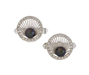 A pair of diamond and cultured pearl cufflinks, the panels of openwork scalloped shell design, with circular-cut diamond border to black cultured pearl centres