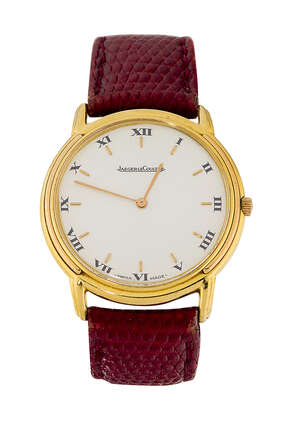 
	
		An 18ct gold quartz wristwatch by Jaeger leCoultre, the cream coloured circular dial with...