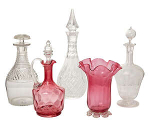 
	
		A cranberry glass decanter and stopper, 19th century, together with a cranberry glass...