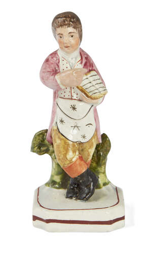 
	
		A Staffordshire Masonic gentleman, early 19th century, the polychrome figure modelled...