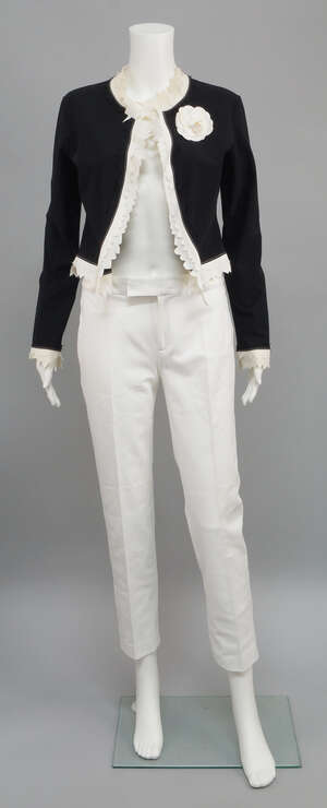 
	
		Chanel: a black nylon cropped open fronted jacket, with contrasting double row pinked...