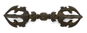 
	
		A Tibetan bronze vajra, late 19th century, each end decorated with four blades issuing...