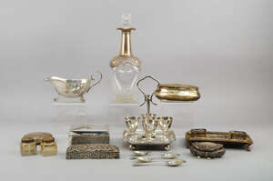 
	
		A silver egg cup stand, Sheffield 1911, Walker & Hall, the stand with four egg cups and...