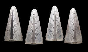 
	
		René Lalique (1860-1945), a set of four glass wall appliques with traces of blue staining...