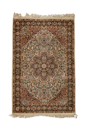 A Persian part silk Isfahan rug, last quarter 20th century, the central field floral medallion...