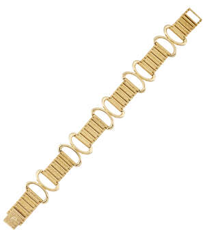 A flexible bracelet, by Piaget, designed as five inverted loop sections with  articulated textured bar-link connections to a matching clasp, circa 1970, 19.5cm