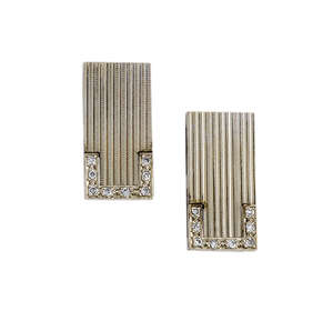 A pair of diamond-set rectangular cufflinks,  one end of each engine-turned panel set with single-cut diamond 'C' shaped accent, to rectangular striate