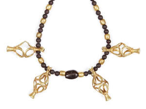 
	
		A composite ancient and modern glass, garnet and gold necklace with openwork vase...
