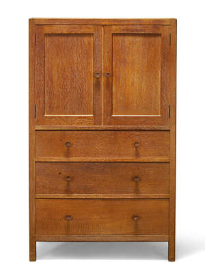 
	
		Heal & Son (British), a limed oak cabinet 
		c.1930, one drawer inset with ivorine disc...