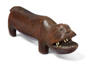 
	
		A Tanzanian hardwood carving of a hippo, early 20th century, carved standing four square...