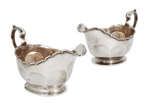 
	
		A pair of silver Mappin & Webb sauce boats, Birmingham, 1928, designed with shaped rims...