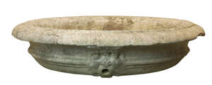 
	
		An Italian marble fountain basin, possibly 17th century, carved with three mask spouts,...