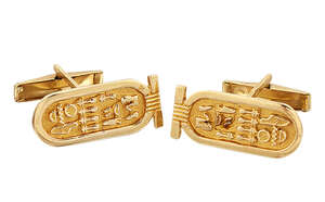 
	
		A pair of Egyptian inspired novelty cufflinks, each with hieroglyphs within royal...