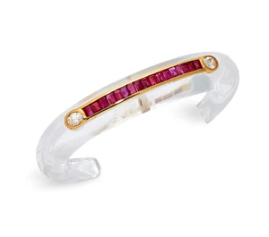 A rock crystal, ruby and diamond bangle, the carved rock crystal torque bangle, (one end...