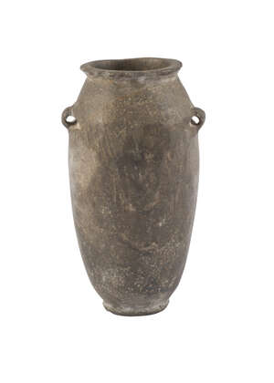 An Egyptian vessel, Early Dynastic period, 1st Dynasty, 2972-2793BC, in the form of  a tapering vase on flat base, 7cm. high 
		 
		Provenance: Private Coll