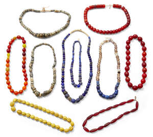 
	
		A collection of African hardstone and glass bead necklaces, early 20th century 
		 
		