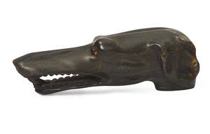 
	
		A carved horn walking stick handle in the form of a dog, 19th century, with glass bead...