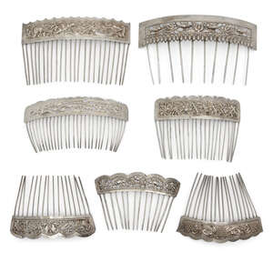 
	
		Eight Chinese silver hair combs, 20th century, each repousse decorated with various...