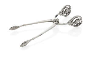 
	
		Georg Jensen (Danish 1866-1935), a pair of silver 'Blossom' pattern sugar nips 
		Mark...
