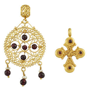 Two garnet-set pendants, the first modelled as a cross, each lobed terminal with single circular cabochon garnet accent, length 3.9cm, the second of openwork c