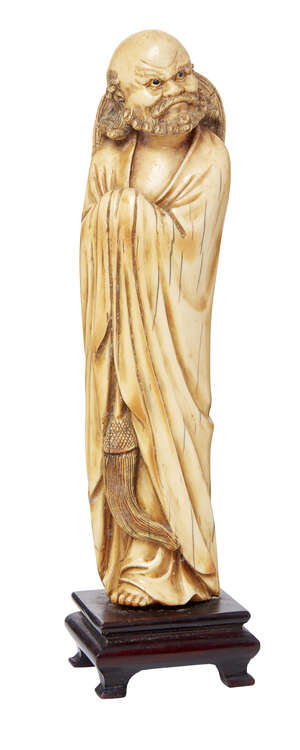 
	
		A Chinese ivory model of a standing bearded lohan, late 19th/early 20th century, modelled...