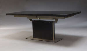 
	
		A contemporary extending dining table by BoConcept, the ebonised top with foldout...