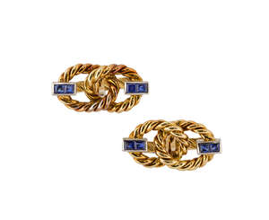 A pair of sapphire cufflinks, by Tabbah, designed as two interlocking rope hoops, each intersected by two calibre-set sapphires, hinge fittings, both signed N.
